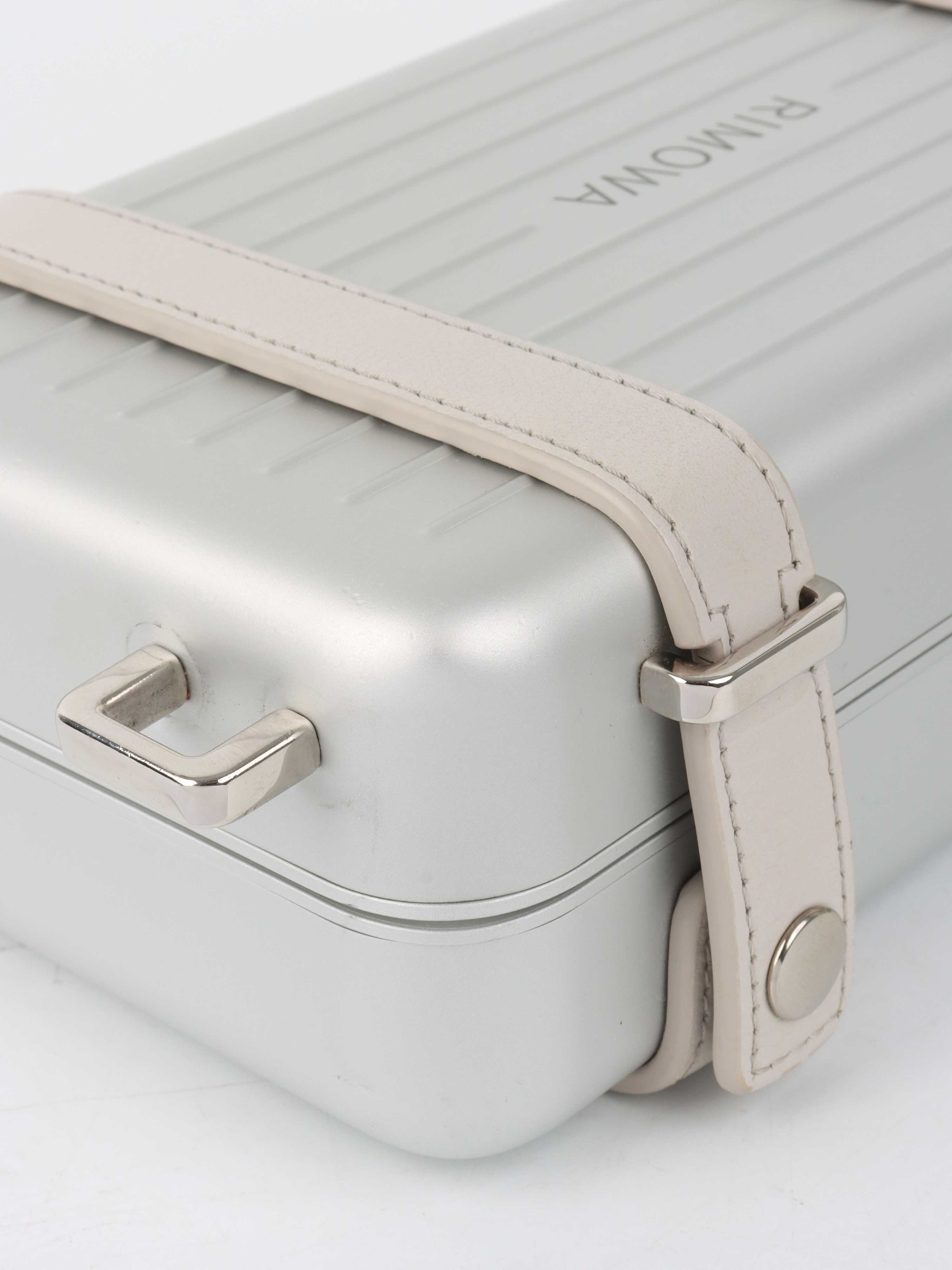 Dior x RIMOWA Silver Personal Clutch Case.