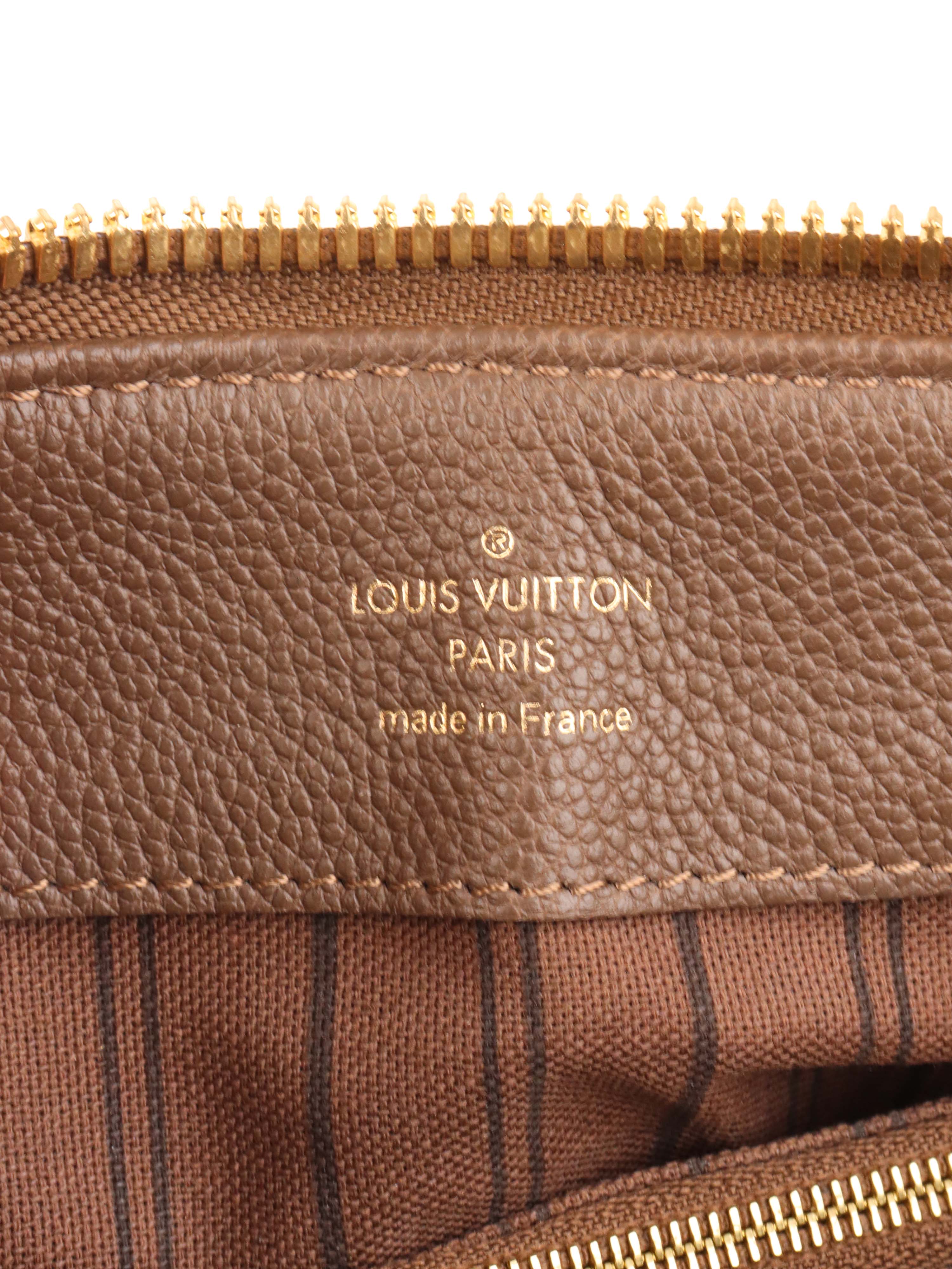 Louis Vuitton Terre Empreinte Monogram Audacieuse PM Bag.