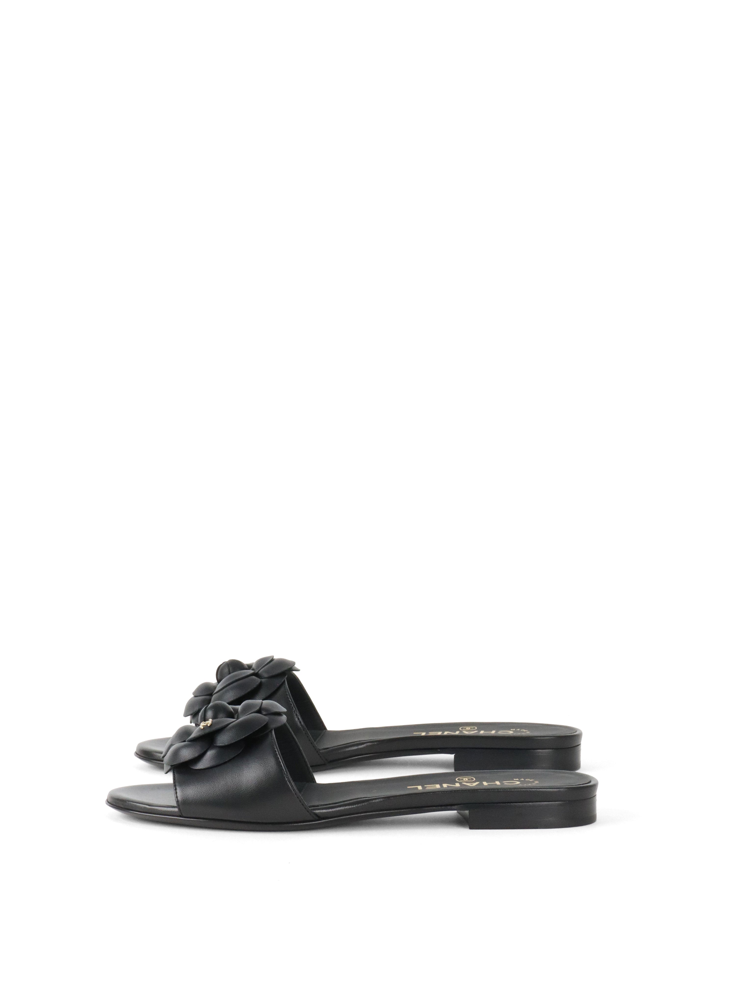 Chanel Black Camellia Slide Sandals.
