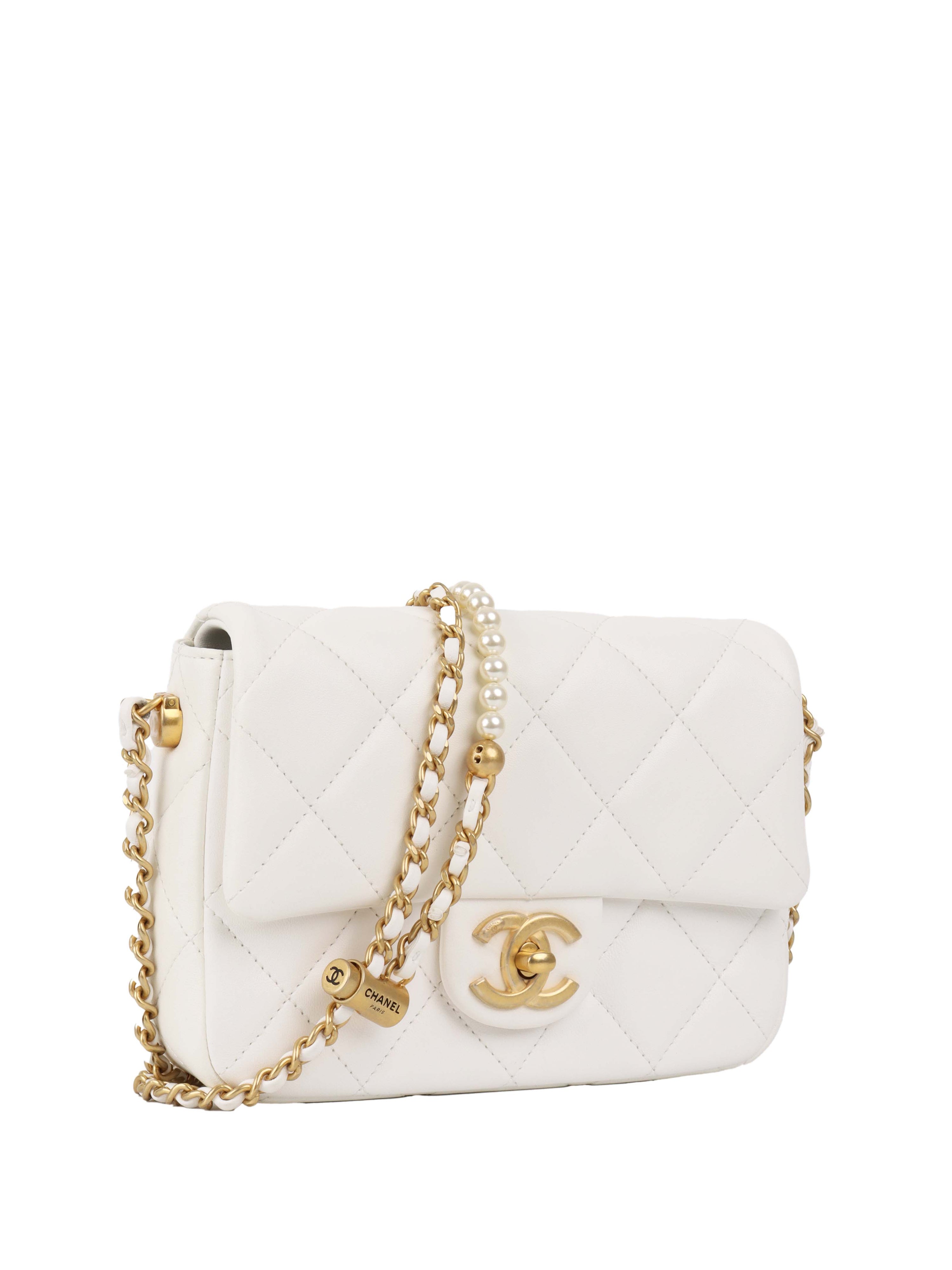 Chanel White and Pearl Chain Flap Bag.