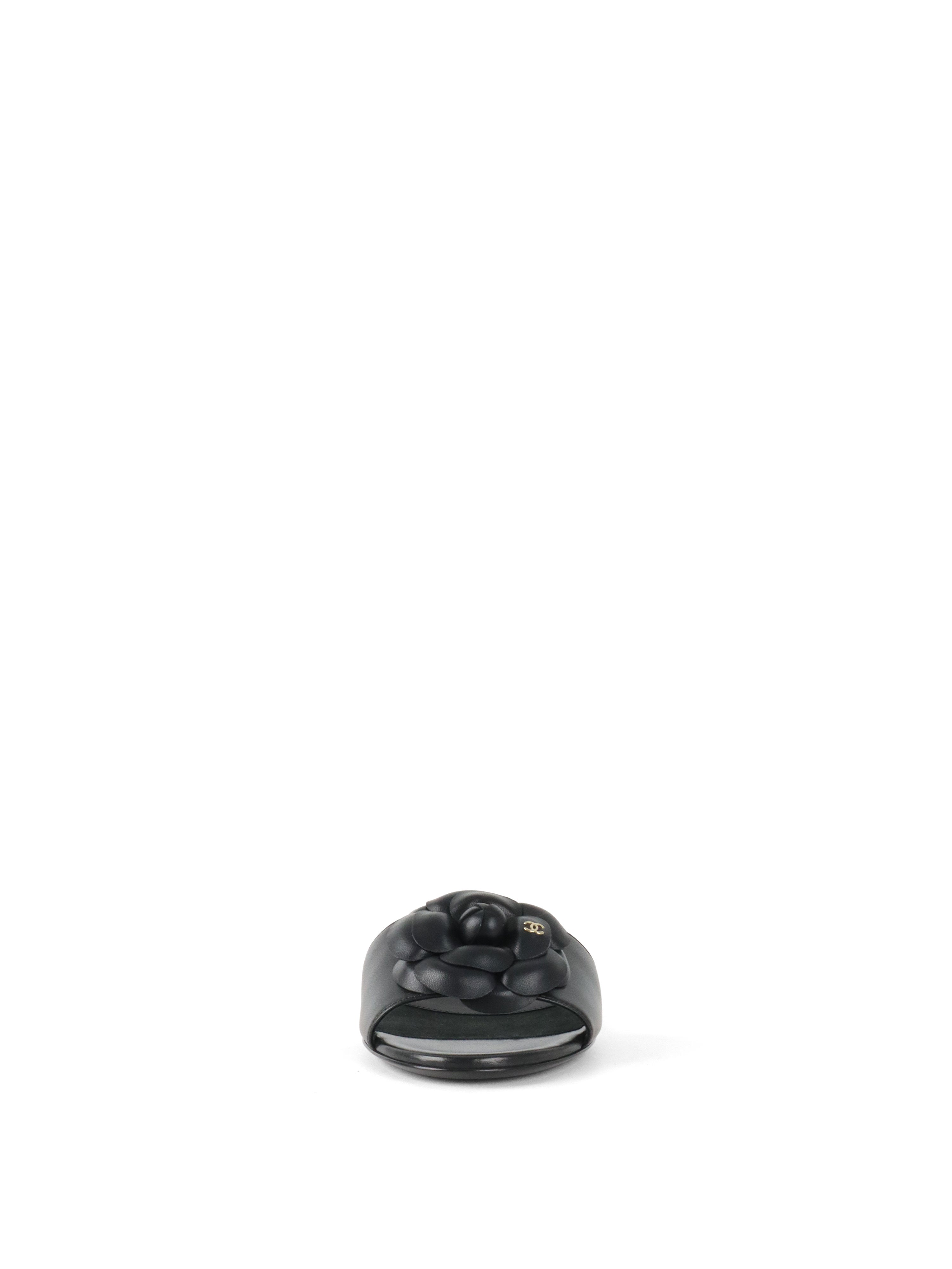 Chanel Black Camellia Slide Sandals.