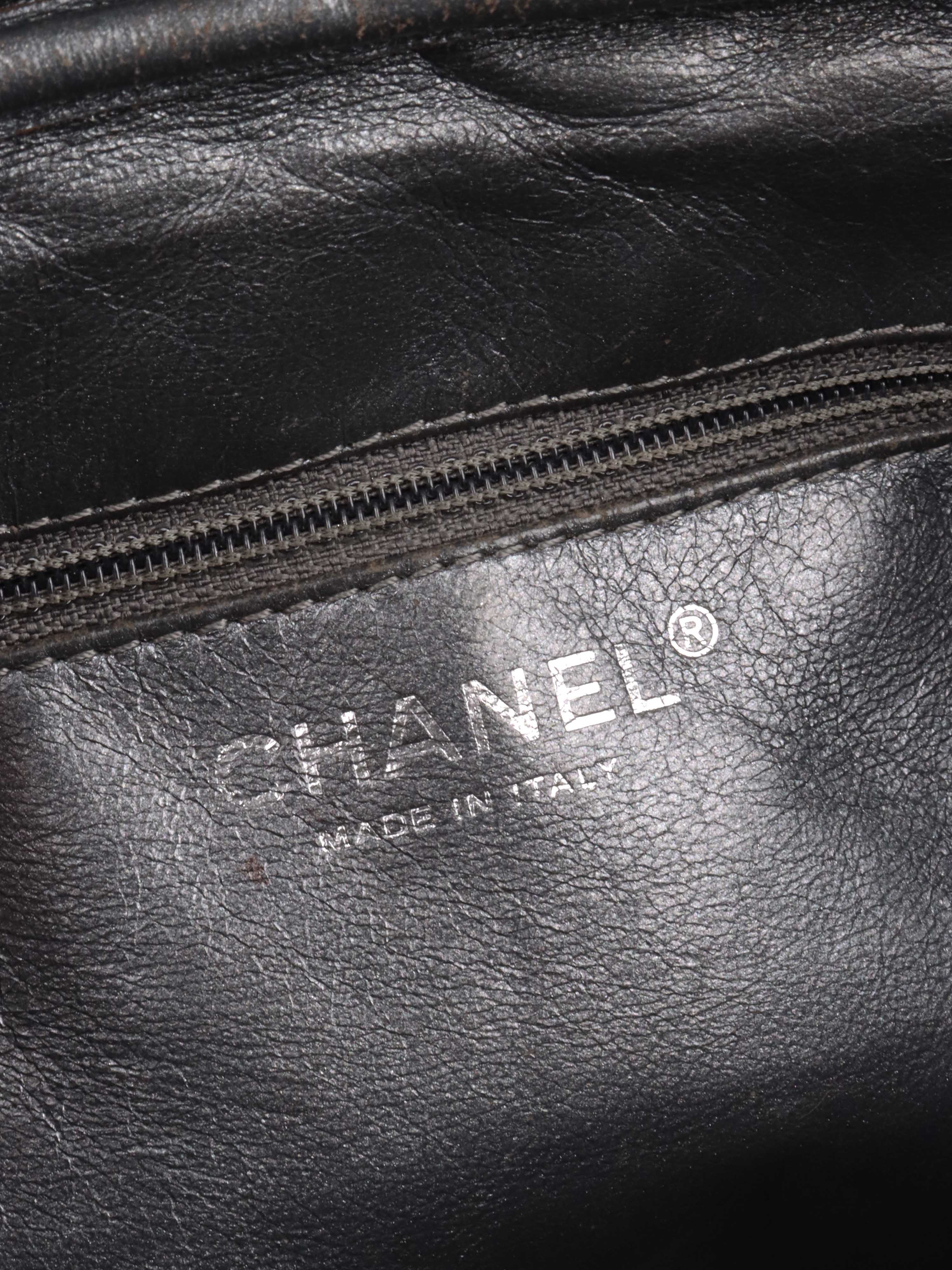 Chanel Metallic Silver 2.55 Reissue Camera Bag.