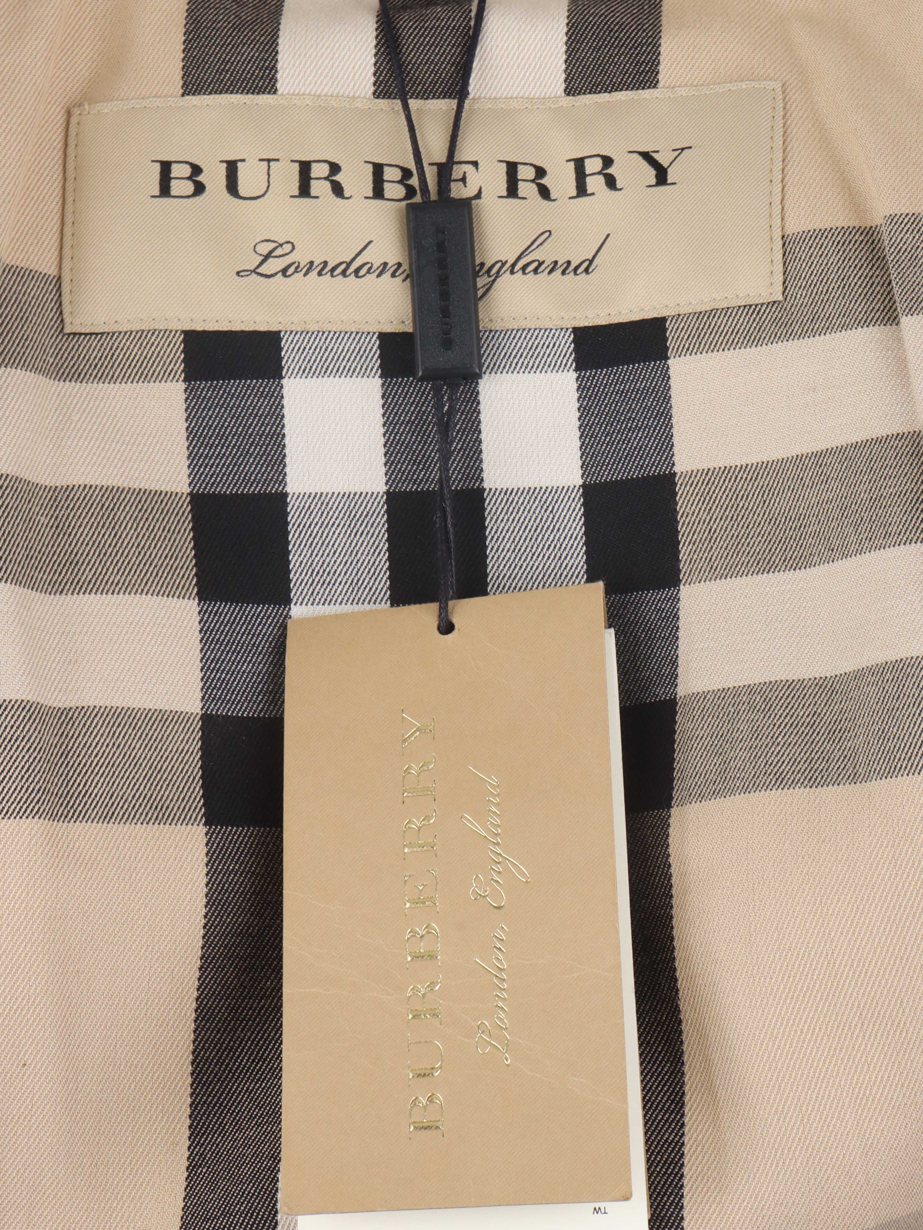 Burberry Tan Trench Coat with Leather Sleeve Straps.