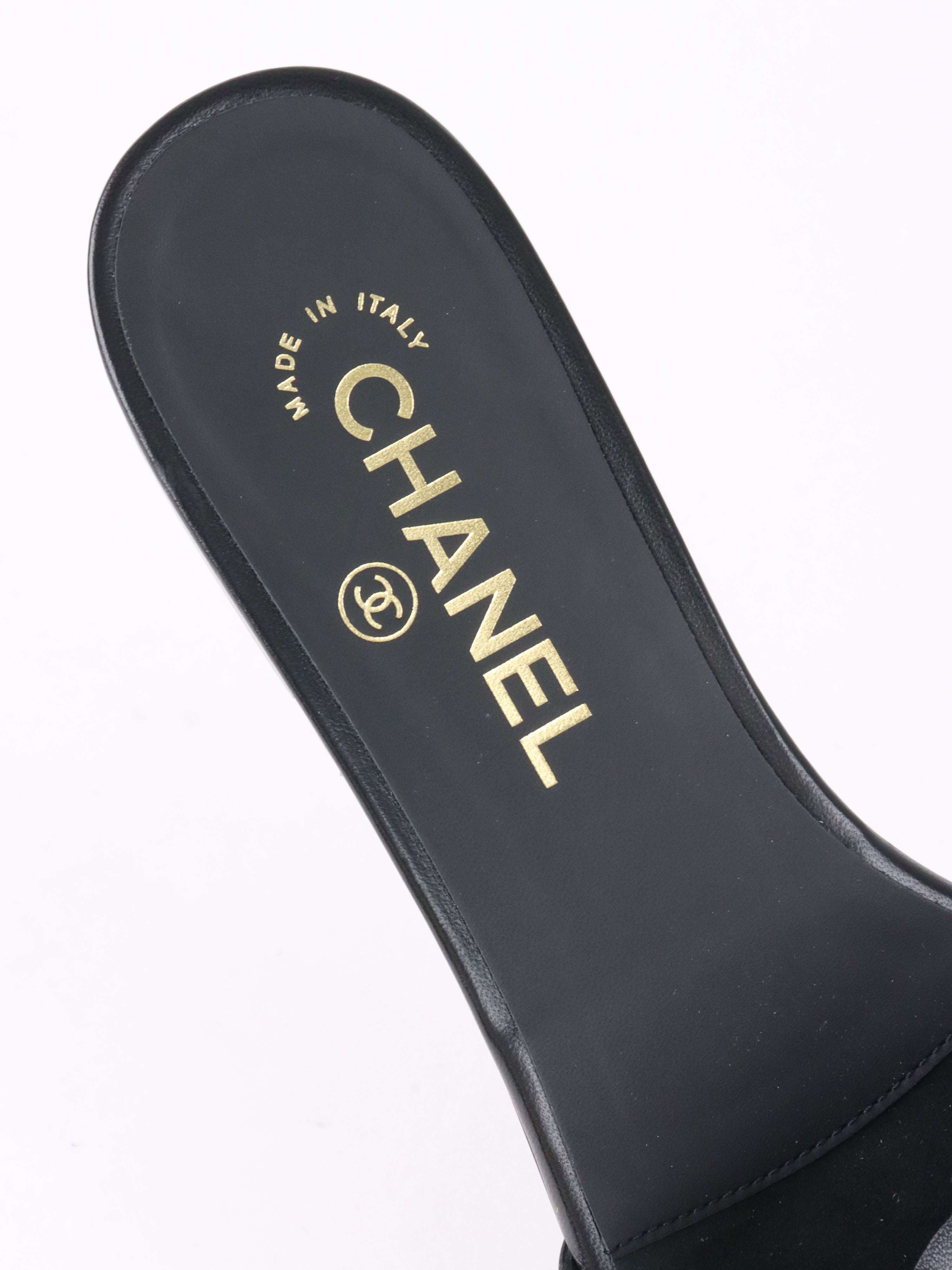 Chanel Black Camellia Slide Sandals.
