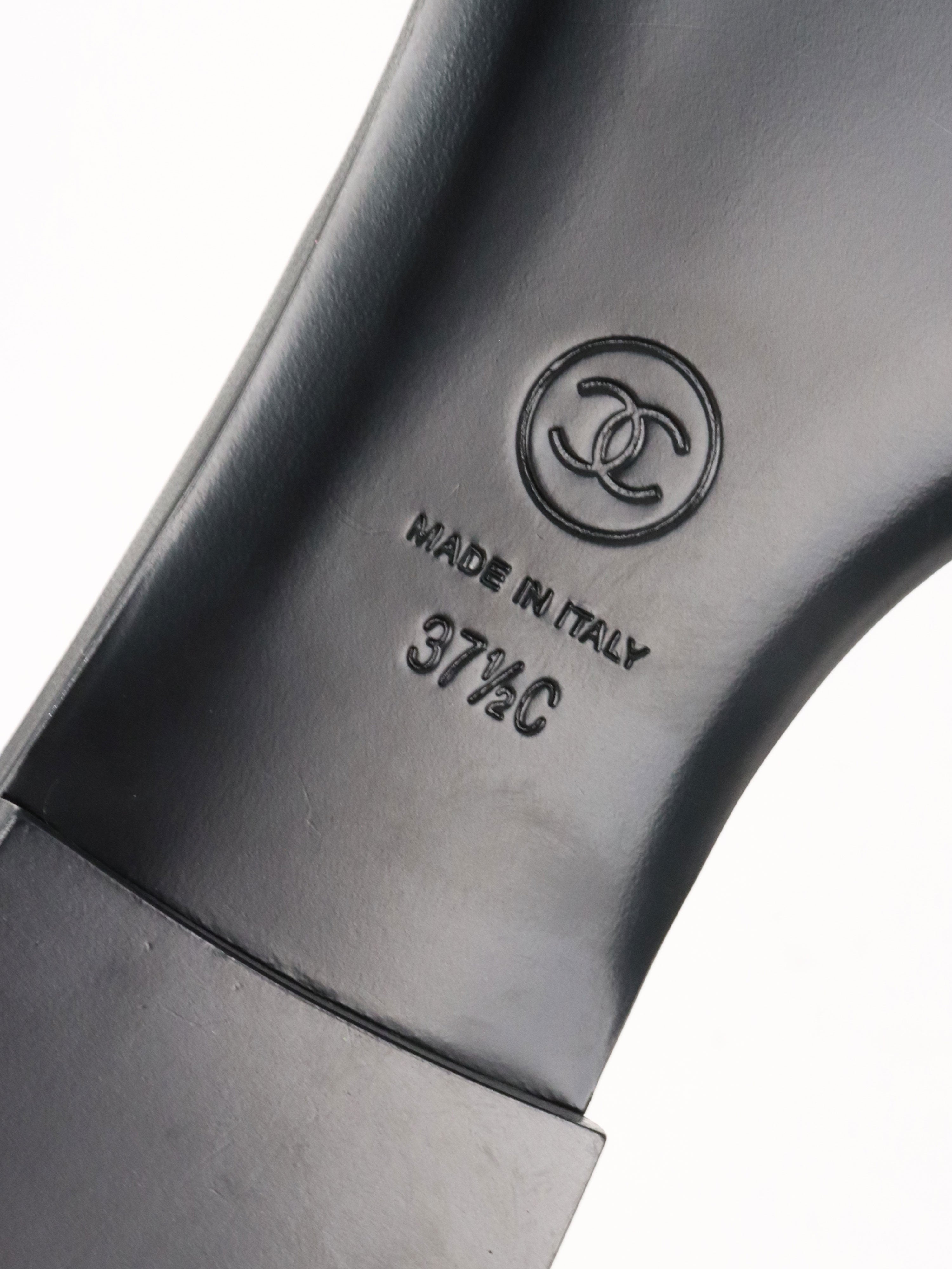 Chanel Black Camellia Slide Sandals.