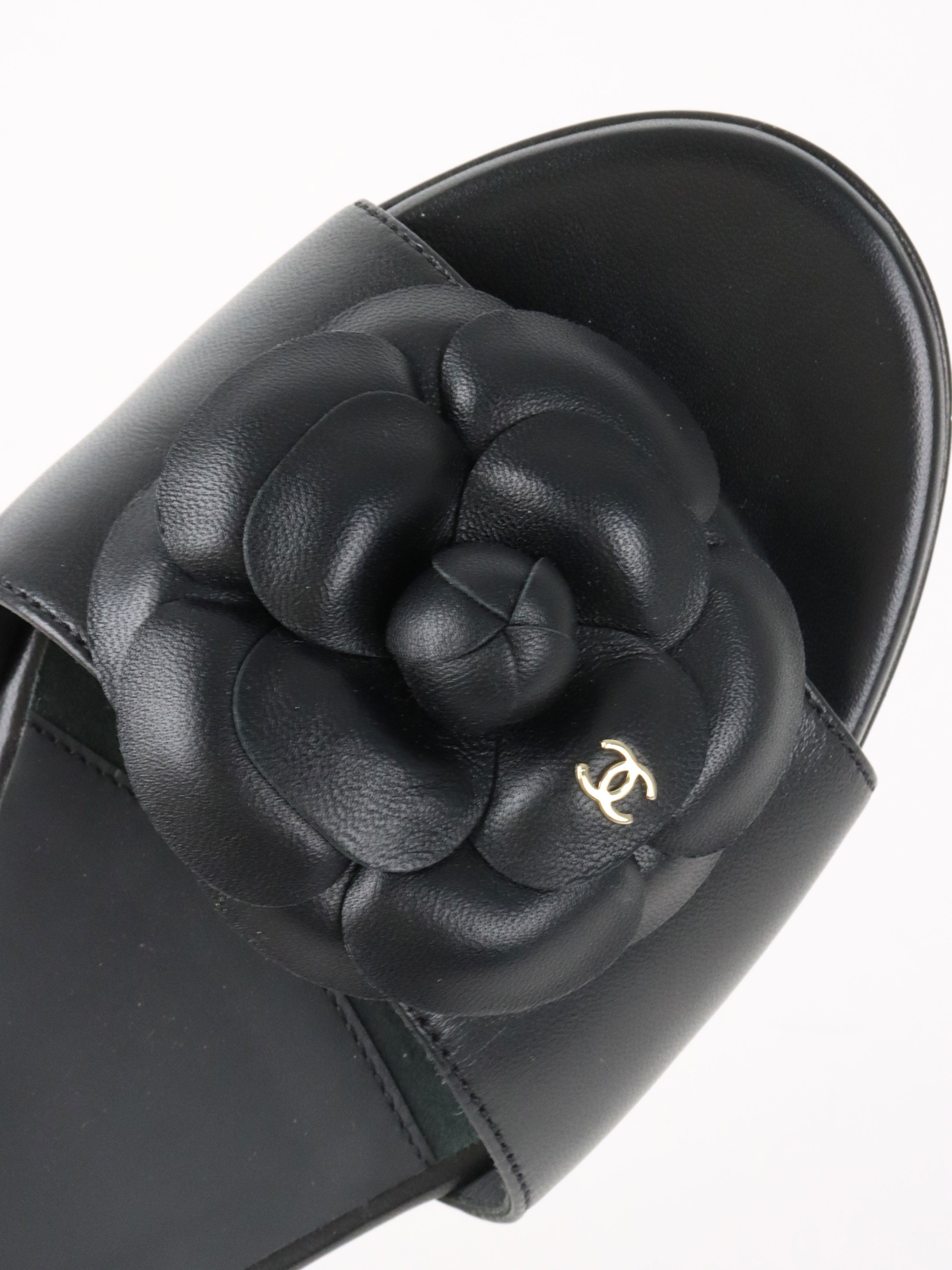 Chanel Black Camellia Slide Sandals.