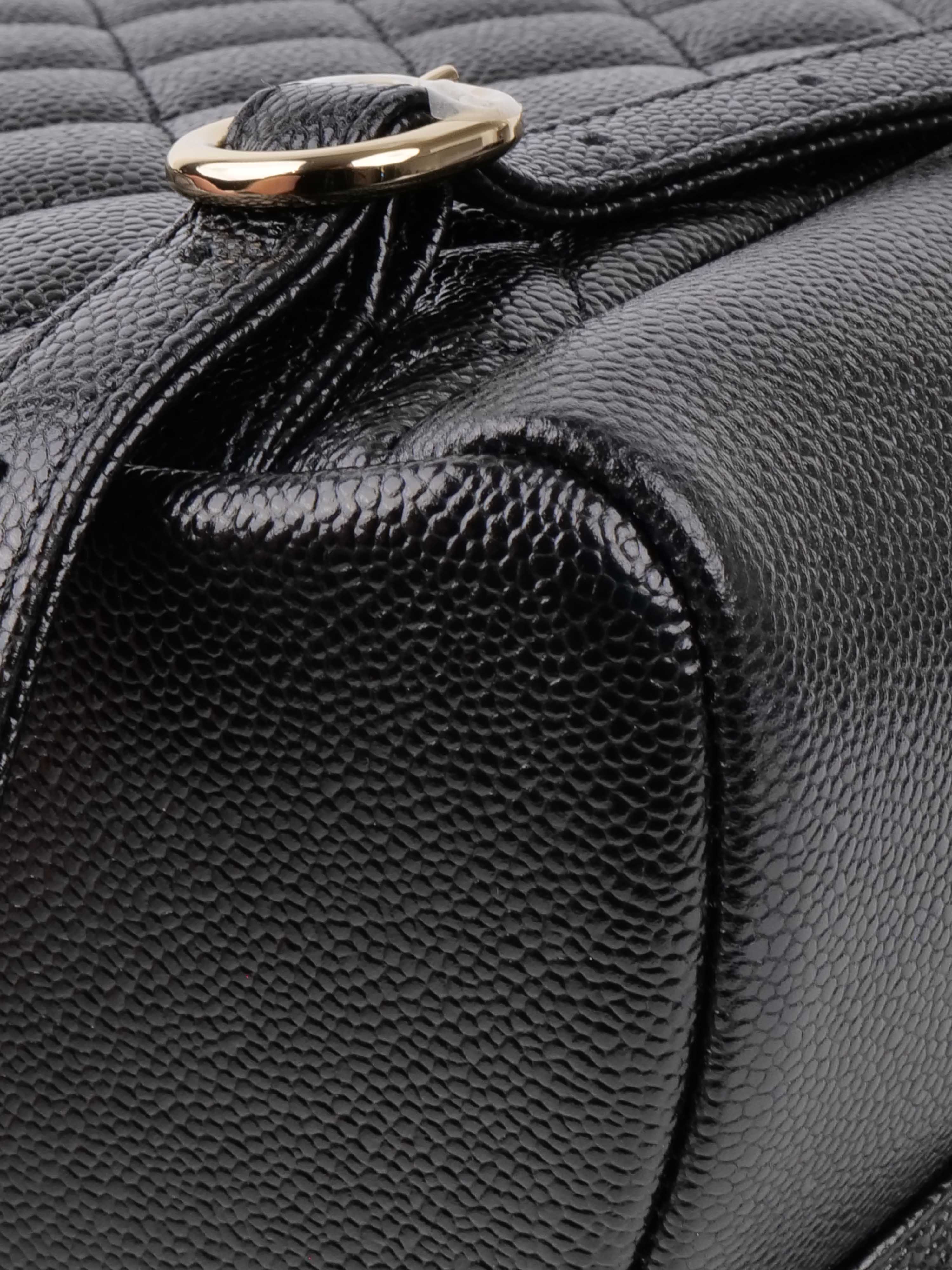 Chanel Black Caviar Backpack.