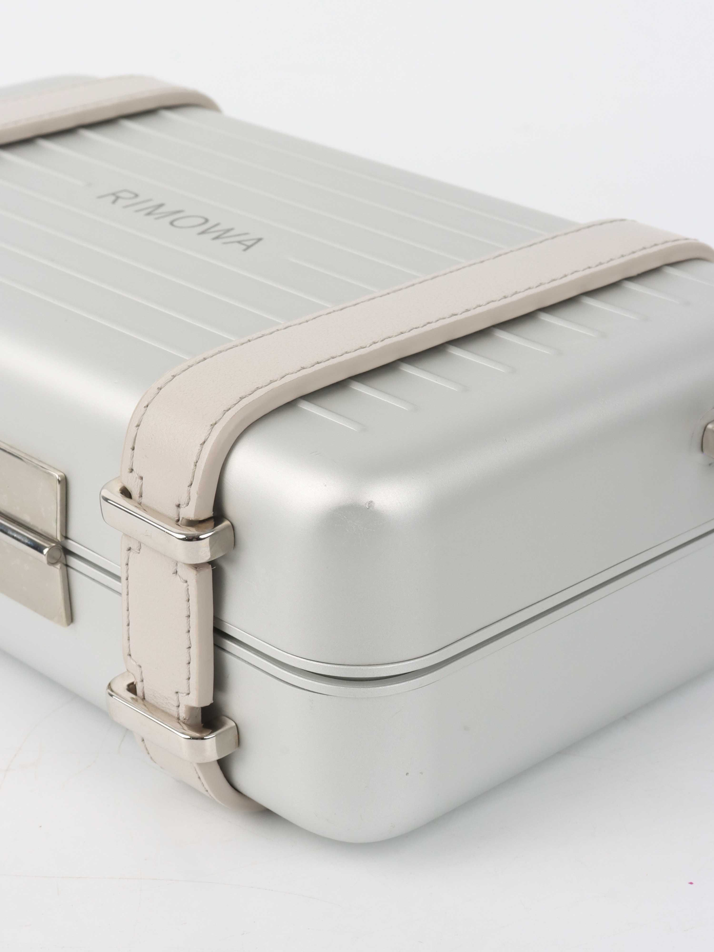 Dior x RIMOWA Silver Personal Clutch Case.
