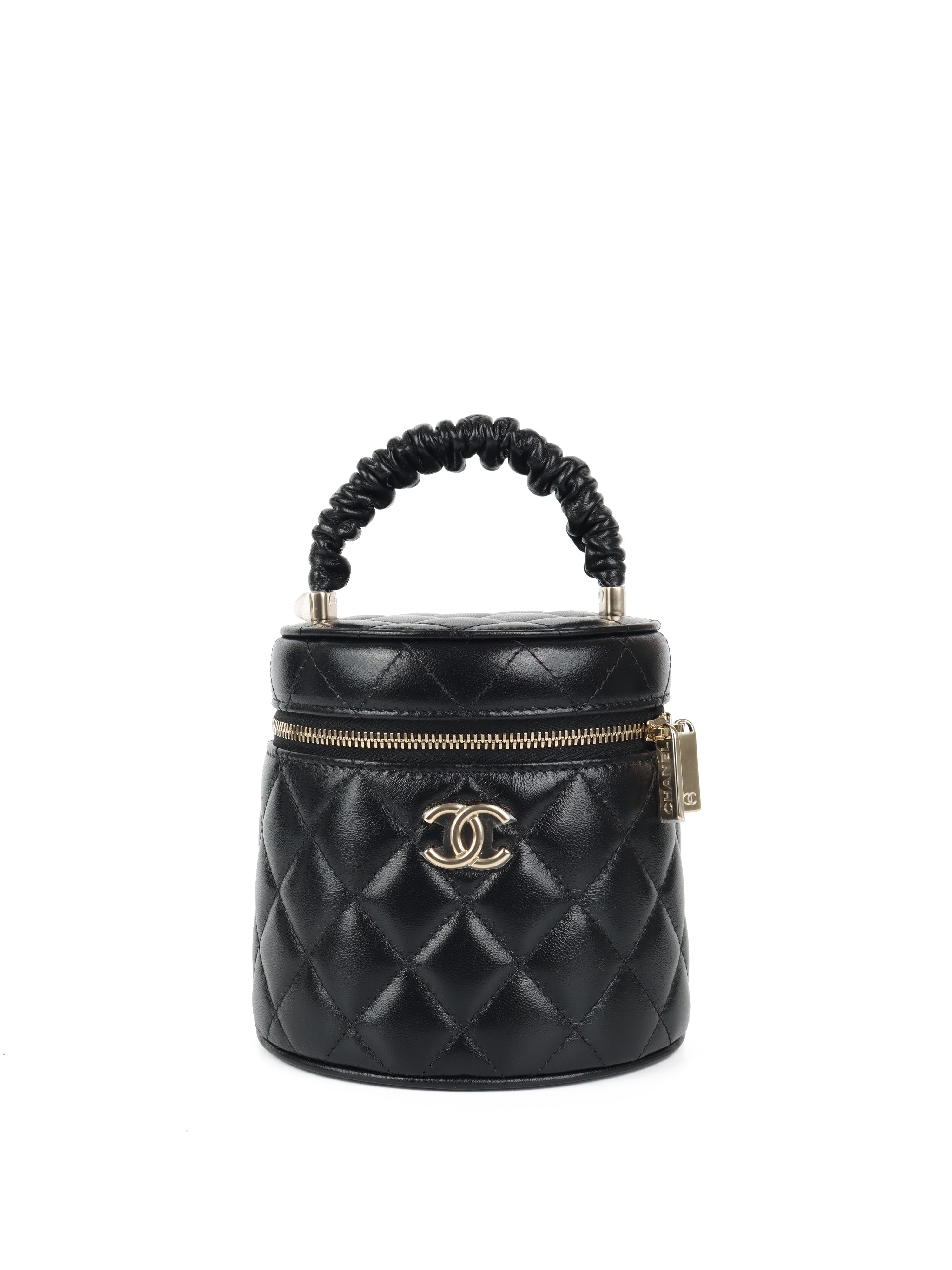 ChanelBlack22STopHandleVanityBag-1.jpg