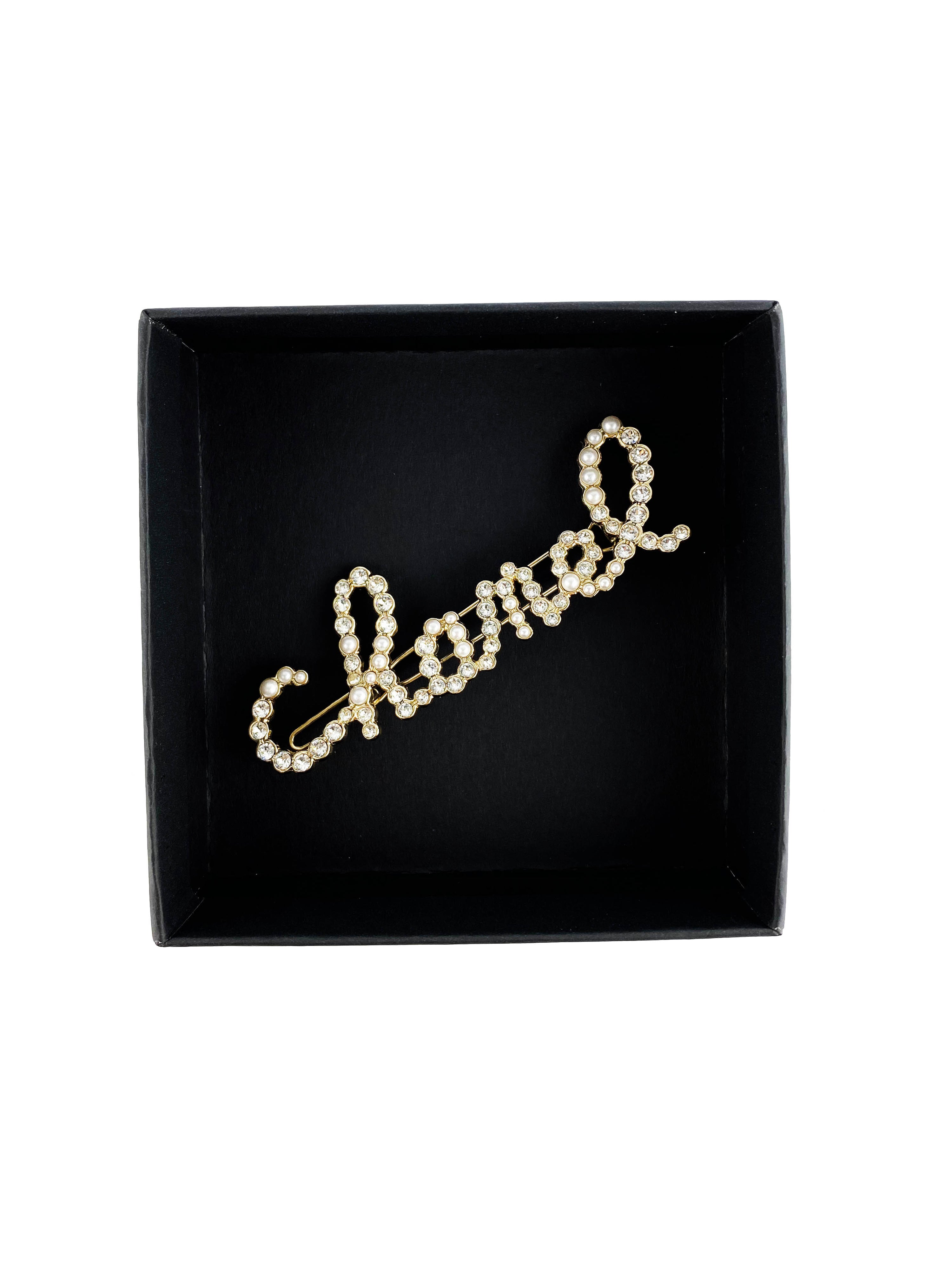 Chanel Swirling Logo Faux Pearl 
Crystal Hair Clip